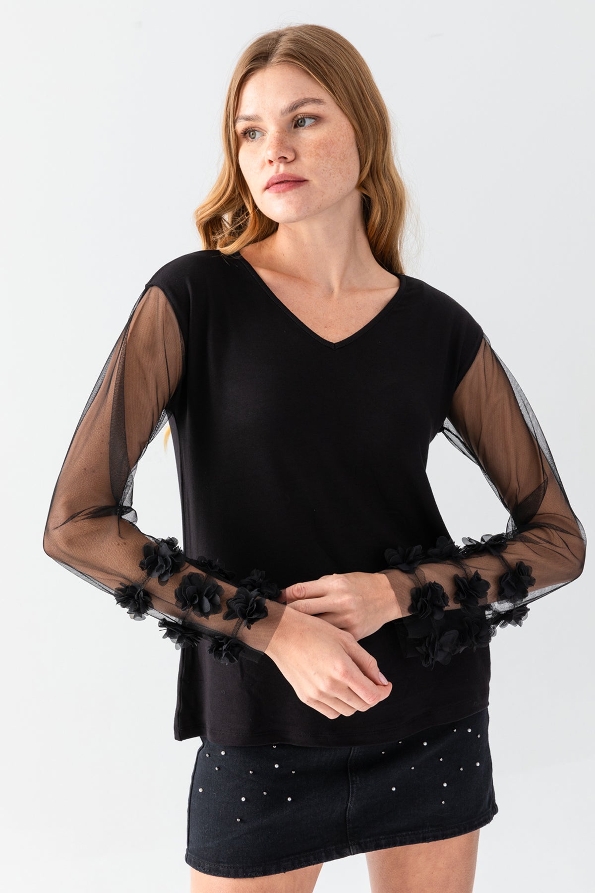 Women's Black V-Neck Casual Blouse with Transparent Sleeves and Pom-Pom Details on the Cuffs