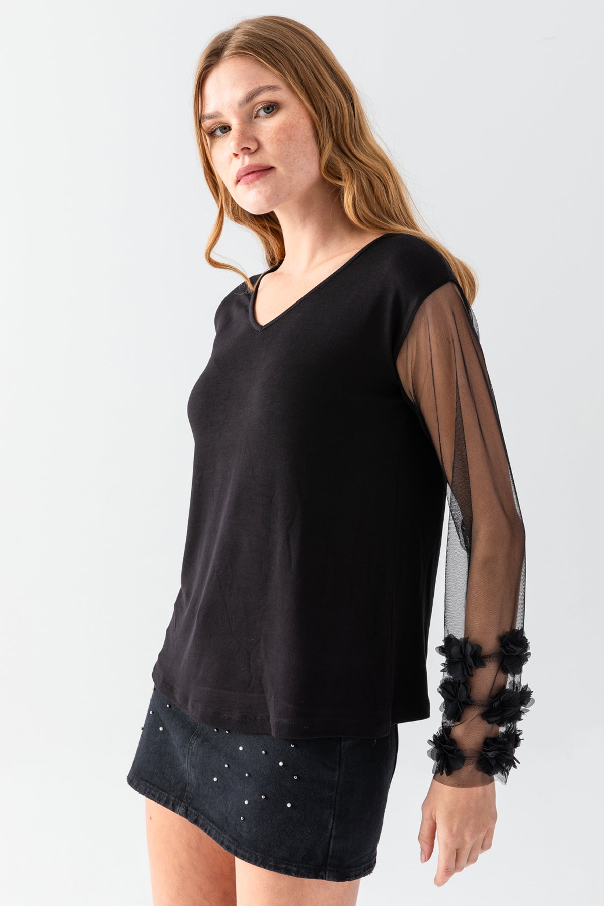 Women's Black V-Neck Casual Blouse with Transparent Sleeves and Pom-Pom Details on the Cuffs
