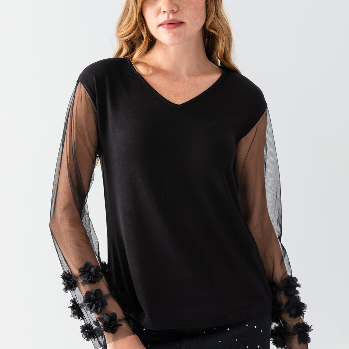 Women's Black V-Neck Casual Blouse with Transparent Sleeves and Pom-Pom Details on the Cuffs