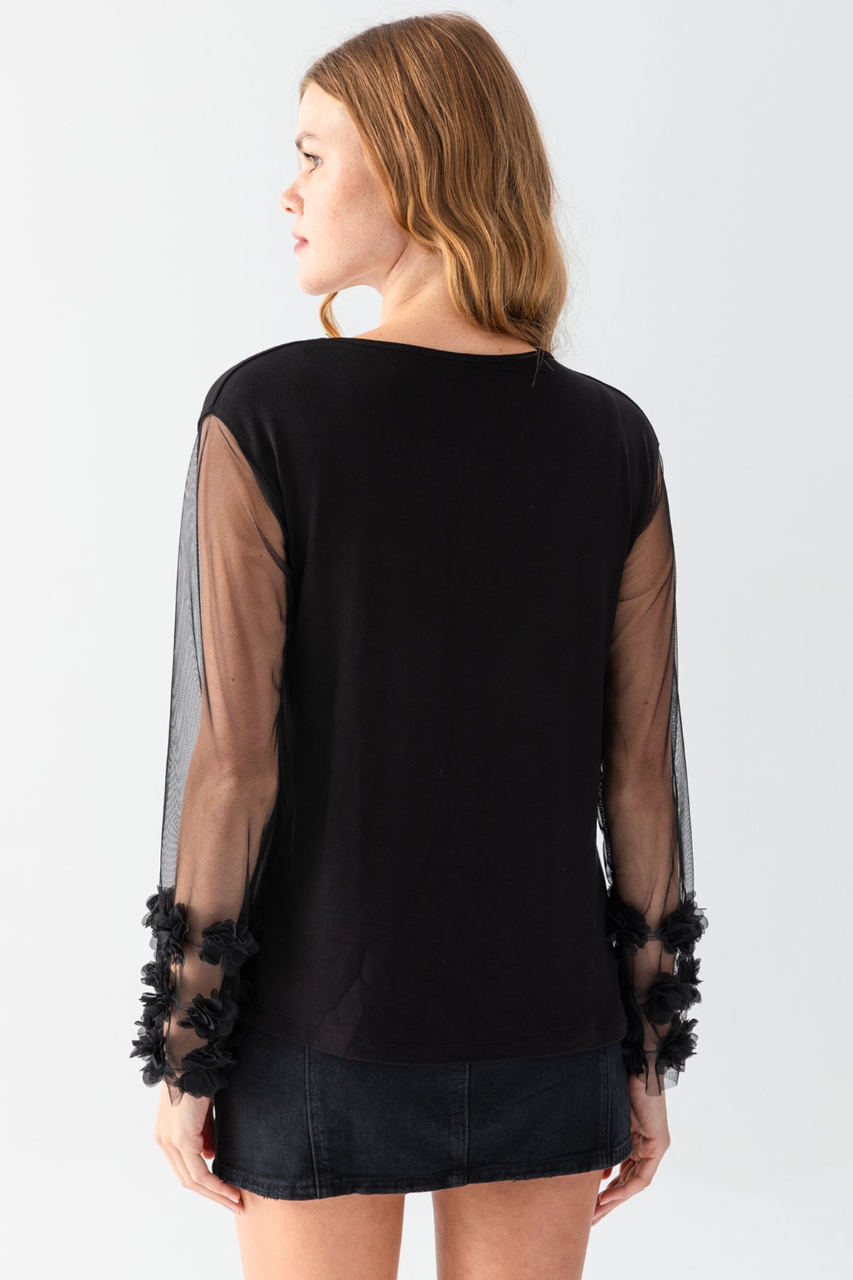 Women's Black V-Neck Casual Blouse with Transparent Sleeves and Pom-Pom Details on the Cuffs
